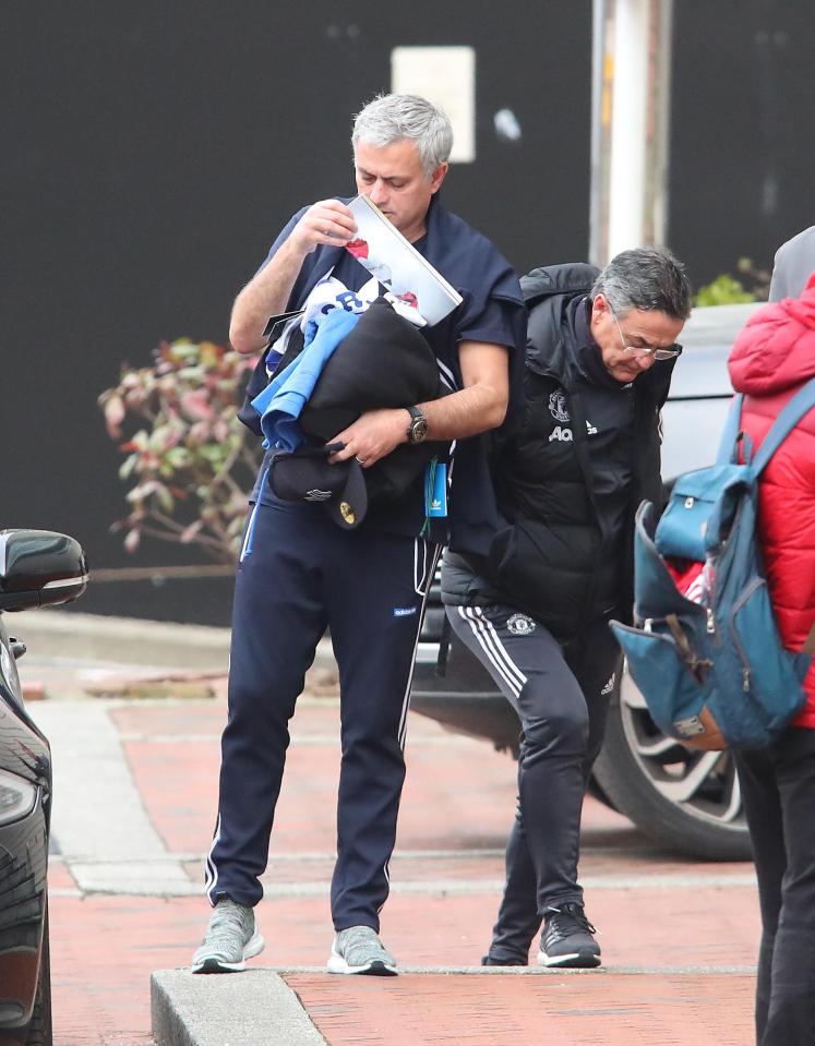  Jose Mourinho struggled to hold all of the merchandise as he made his way into the Lowry Hotel