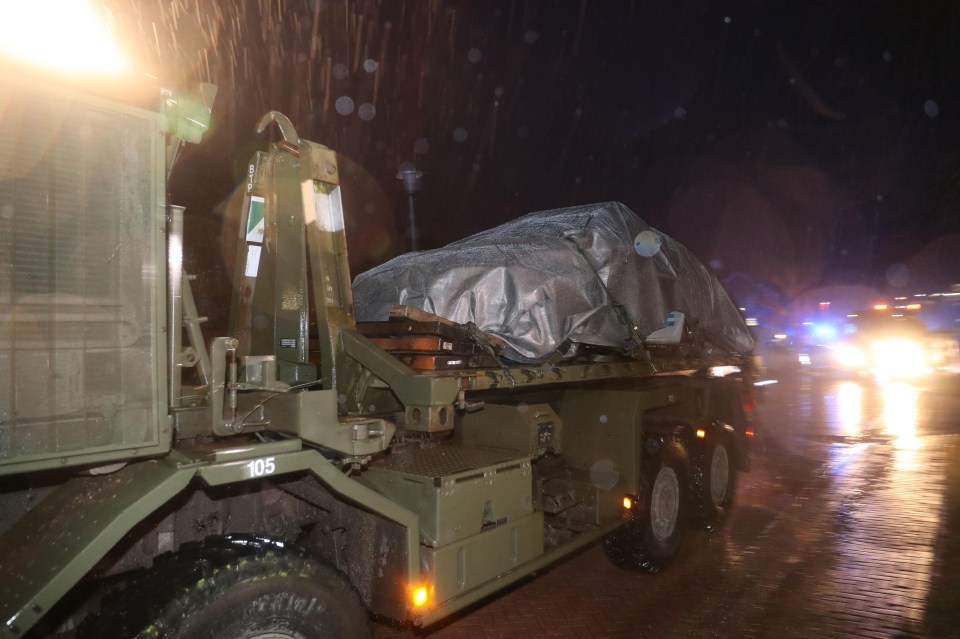 A convoy of police and military vehicles leave Salisbury District Hospital as investigations into the poisoning of a Russian spy continue