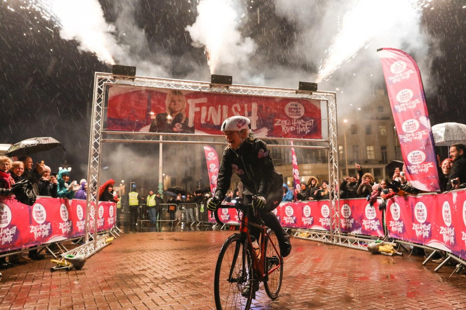 The It Takes Two presenter looks joyous as she passes the finishing line on Brighton Pier 