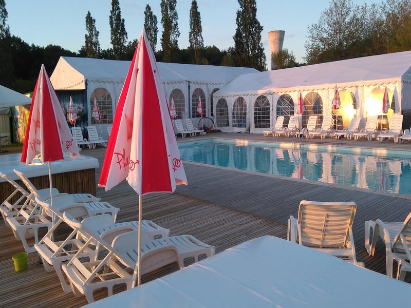 The campsite boasts an outdoor pool area with 'cuddle corners' around it