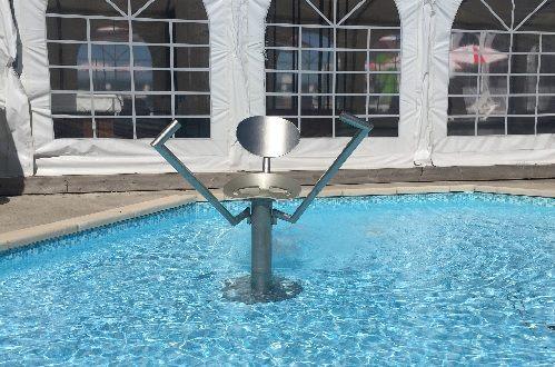 A chair in the pool appears to have a pair of stirrups to put your feet on - wide apart