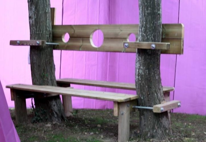 A bench at the campsite doubles up as a medieval-style set of stocks 