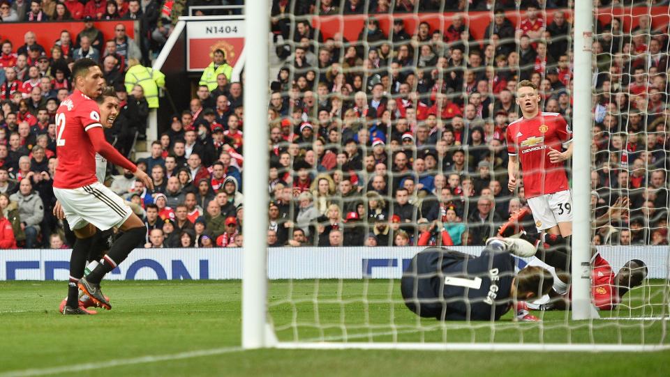  De Gea looks over to Bailly as the ball rolls into the back of the net.