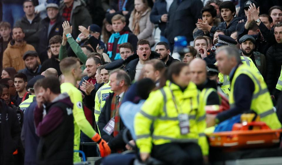  Joe Hart walks over to the fans to try and calm them down.