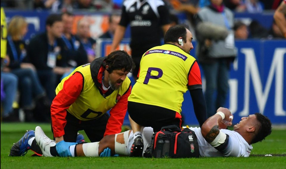  Nathan Hughes is treated on the field during the bruising encounter