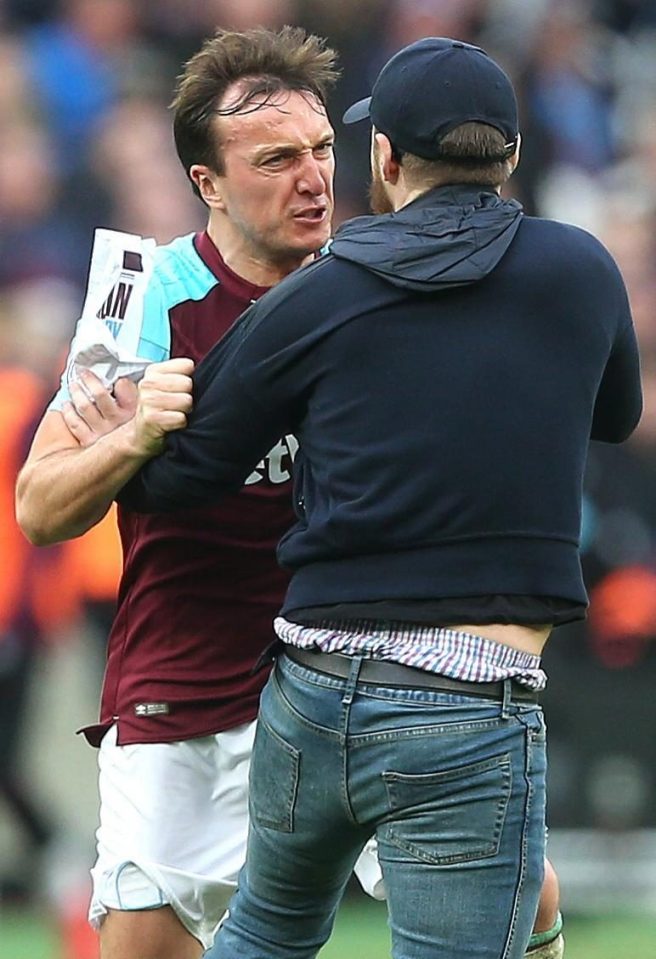  West Ham captain Mark Noble argued and tussled with a pitch invader