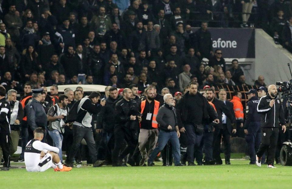  Fearful AEK Athens players dashed back into their changing rooms while PAOK remained arguing