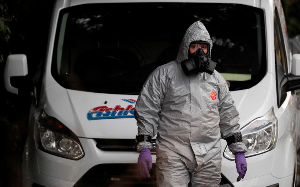  Investigators in protective suits examine a van feared to be contaminated with Novichok after the Salisbury attack