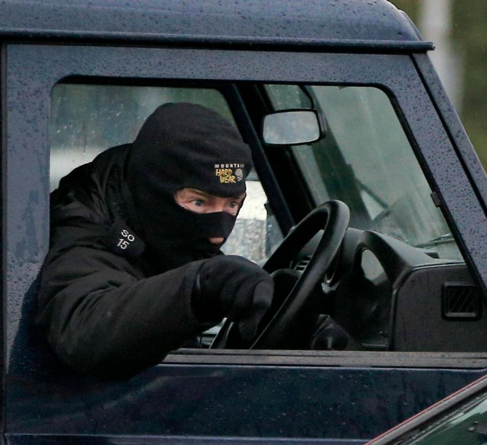  Anti-terror forensic officers remove a recovery vehicle from a house in Winterslow near Salisbury