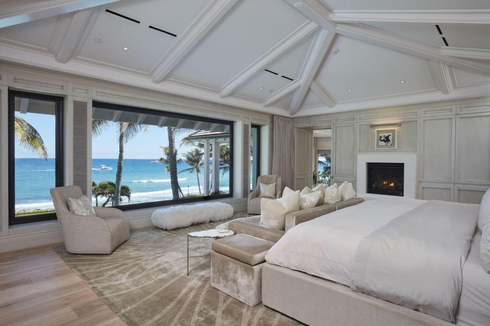  Stunning master bedroom has a view of the ocean and a built-in fireplace