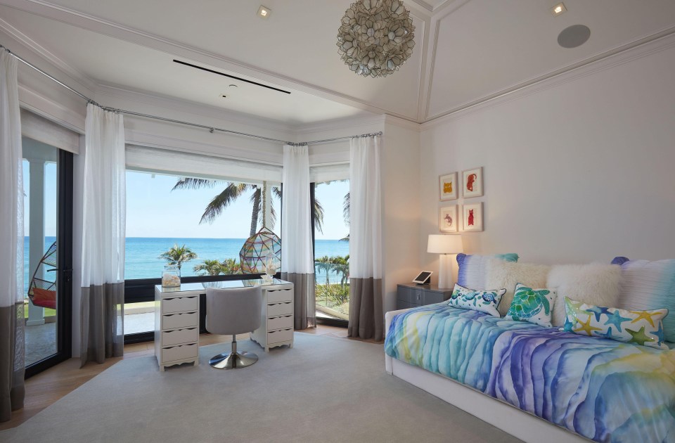 A study desk overlooks the ocean in one fantastic room