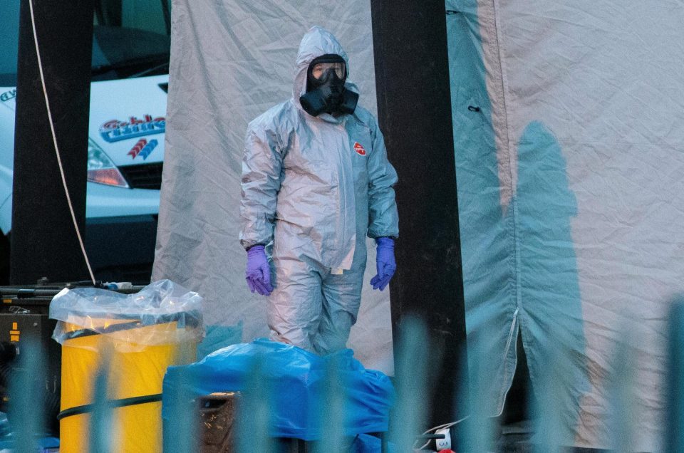  A police officer in a forensics suit as investigations continue into the poisoning