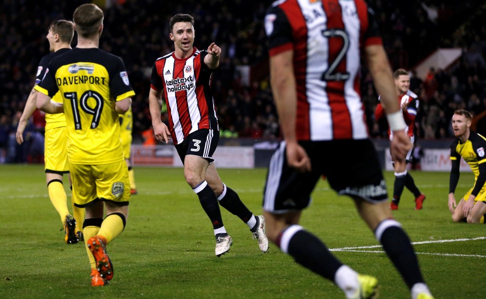 The Blades left-back reacts after putting his side ahead