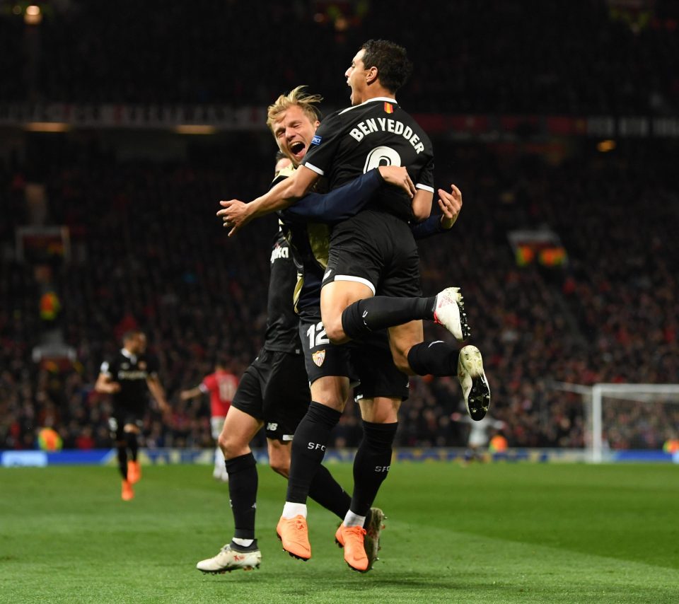  Ben Yedder is mobbed by his team-mates after opening the scoring