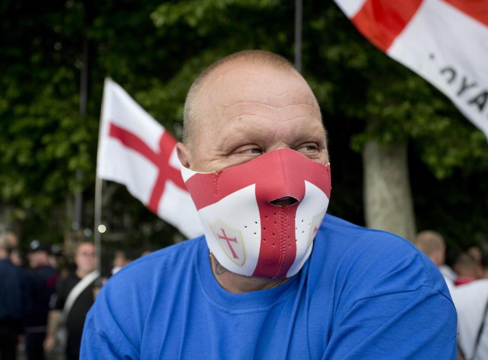  A member of the English Defence League with a mask on during an anti-terror march