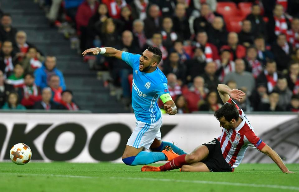  Dimitri Payet wins a penalty after a challenge from Inigo Lekue