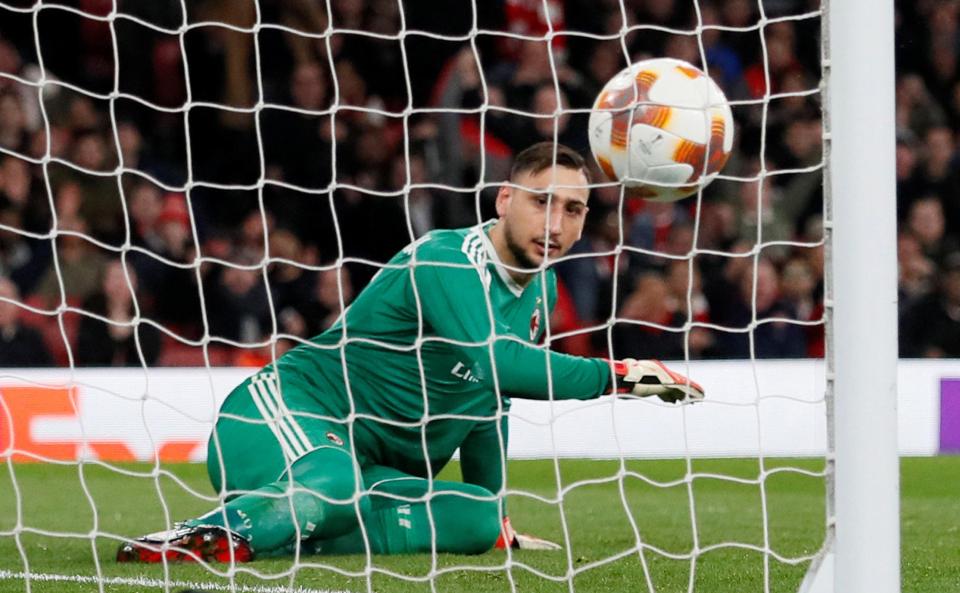  Donnarumma looked embarrassed after pushing in Granit Xhaka's effort