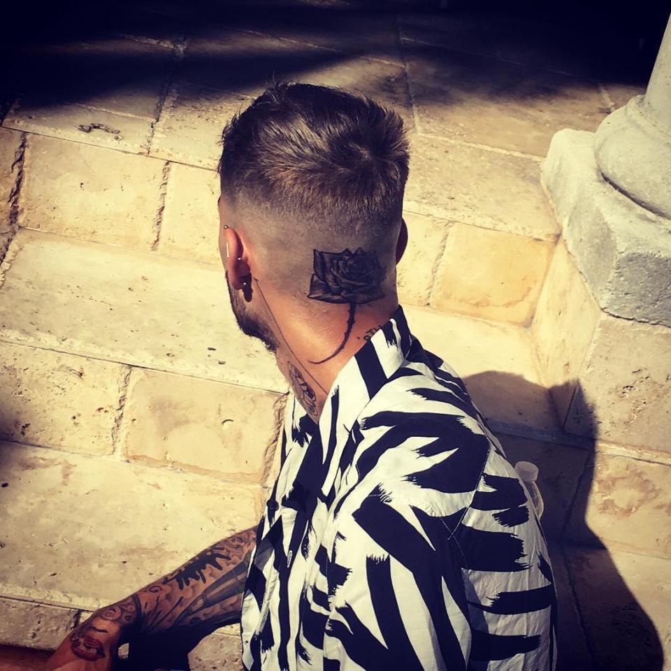  Zayn Malik has revealed a new rose tattoo on the back of his head