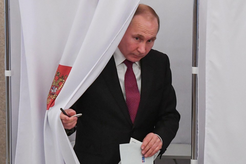 Putin casts his own vote at a polling station in Moscow yesterday 