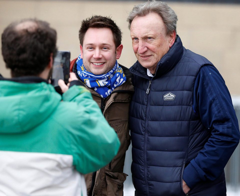  Warnock had the grace to have his picture taken with a travelling fan