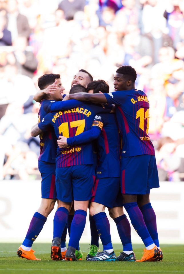  Barca players congratulate Alcacer after his tidy finish