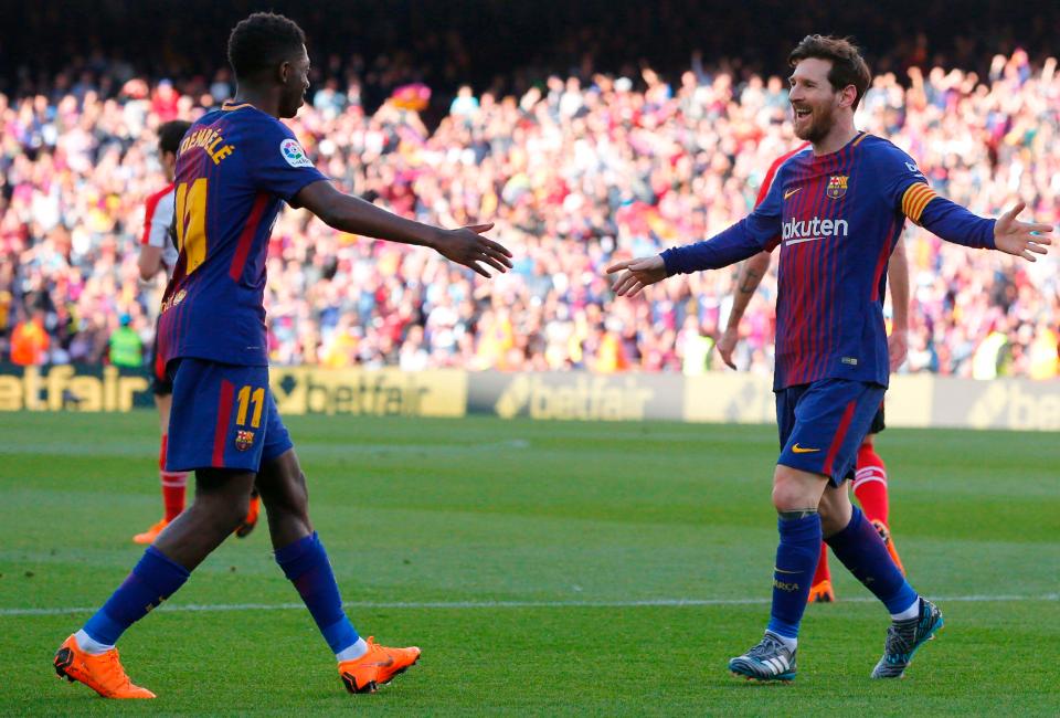  Messi reacts with Ousmane Dembele after netting the second of the afternoon