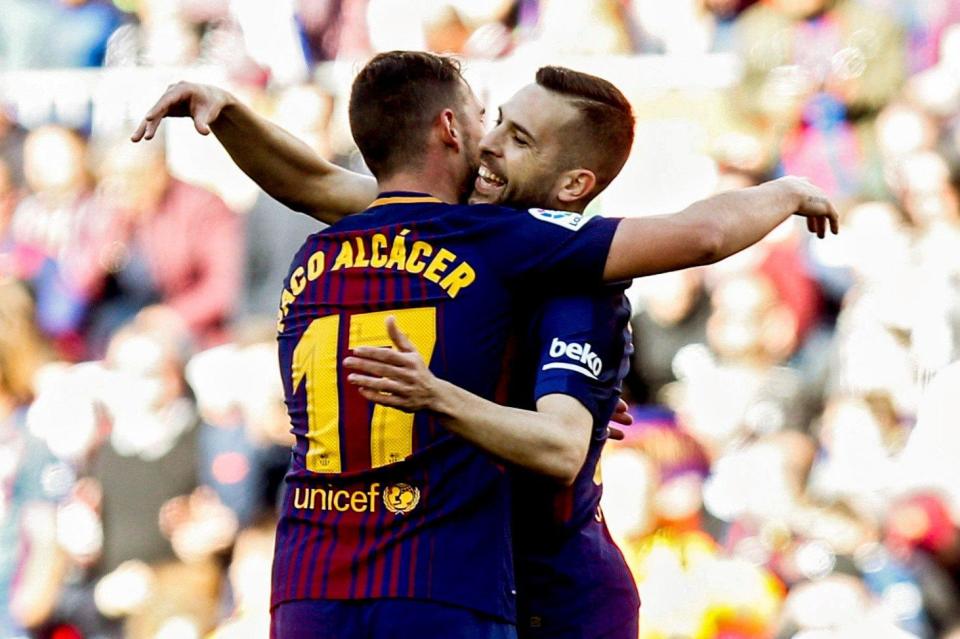  The 24-year-old celebrates with team-mate Jordi Alba after netting just his third La Liga goal of the season