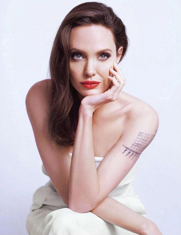  Angelina showed off her arm tattoo which includes coordinates for ex-husband Brad Pitt's place of birth