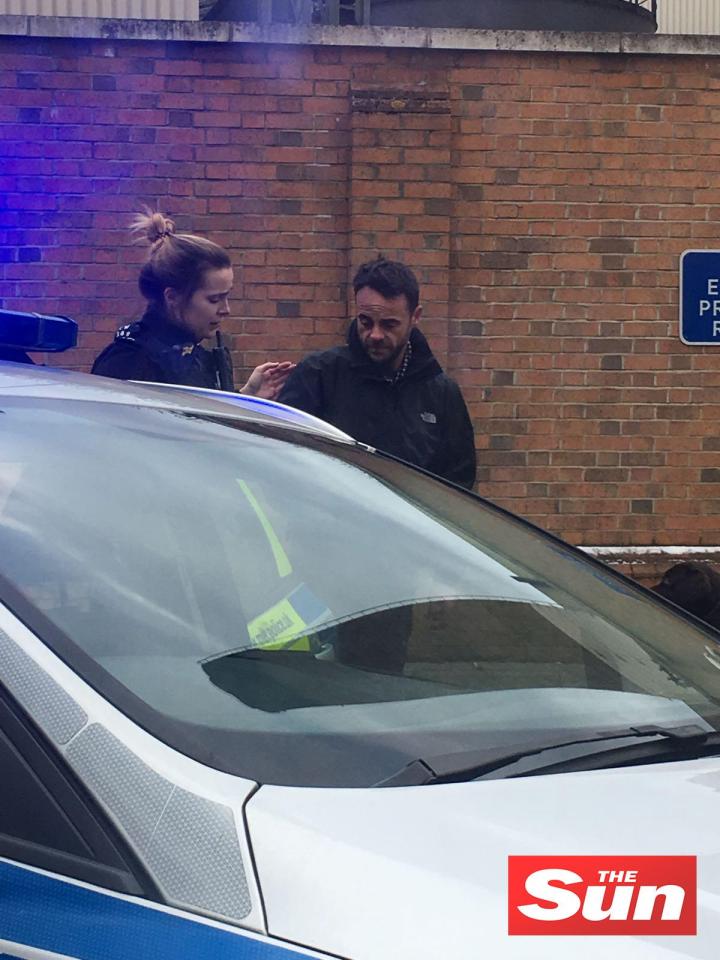  Ant with a policewoman at the scene of his car smash