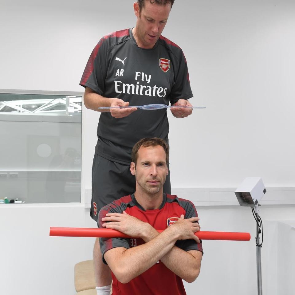  Gunners goalkeeper Petr Cech seemed to be working on his balance or having his height measured