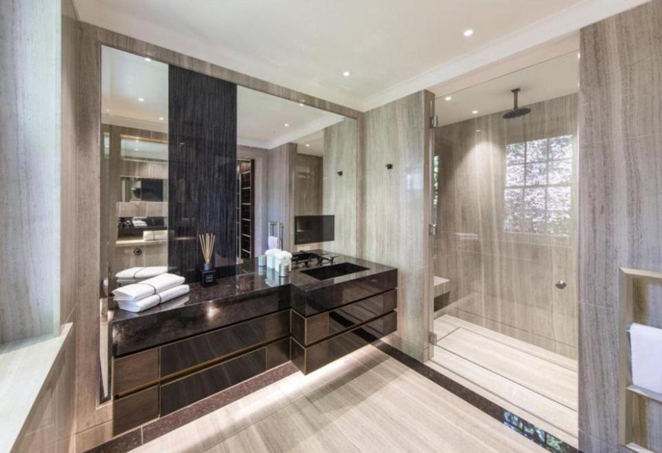  Pierre-Emerick Aubameyang's luxury bathroom has a huge walk-in shower and TVs inset in the mirrors