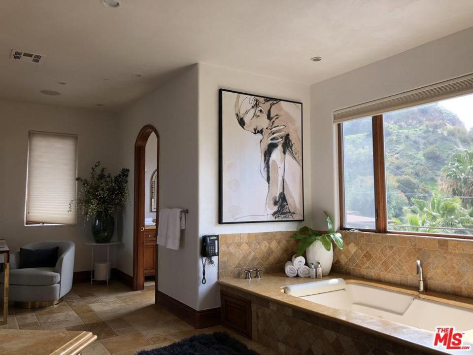  Her property has several bathrooms too with stunning views overlooking the Hollywood Hills