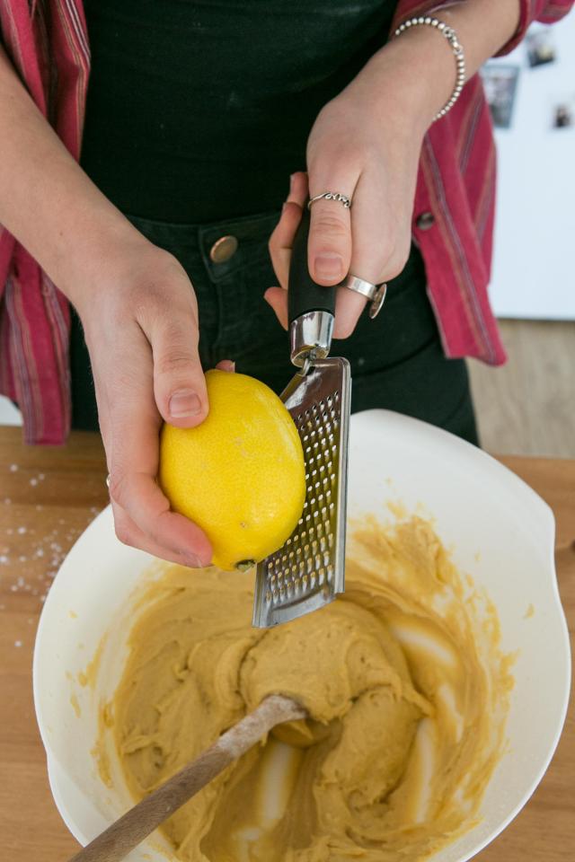  After you sift the flour and mix it into the batter then you can start zesting the lemon