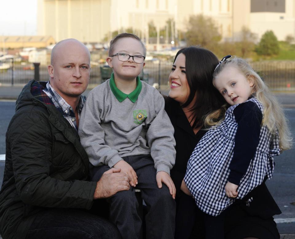  Mike Wilkinson with his wife Kelly and their two children