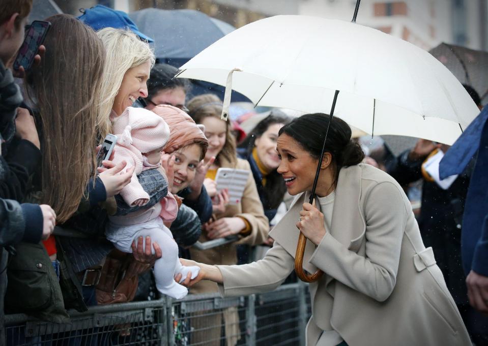  Meghan Markle pictured meeting a tot in Belfast