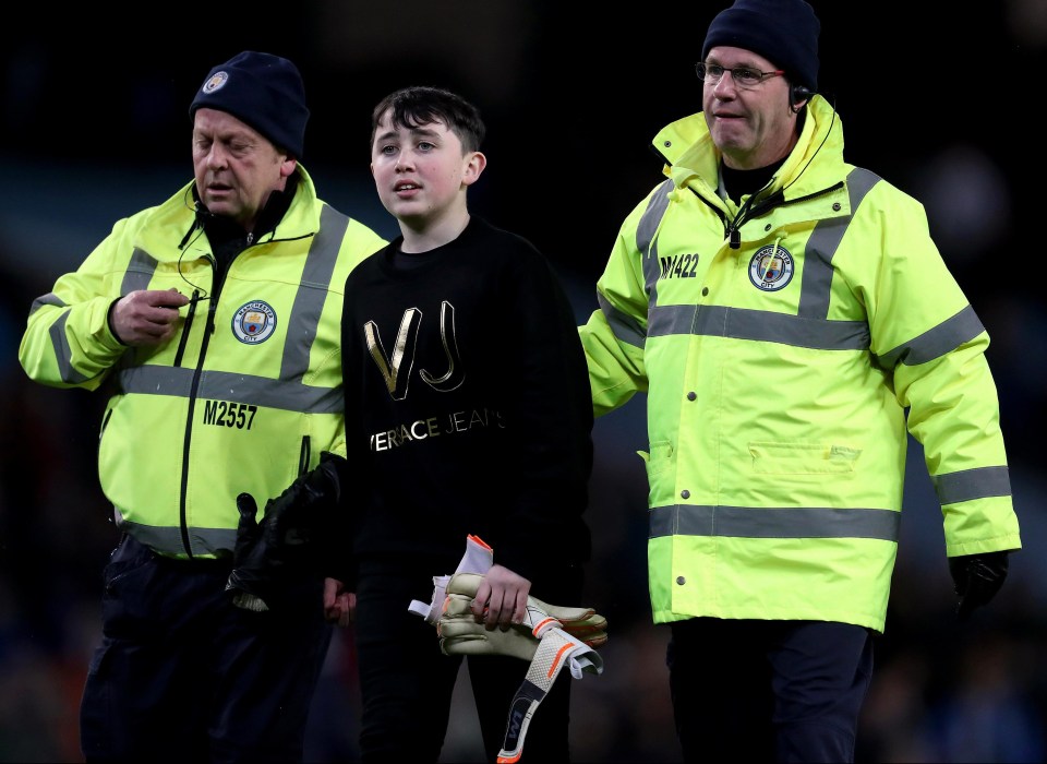 This young fan must be delighted with his unexpected memento from the friendly at Etihad