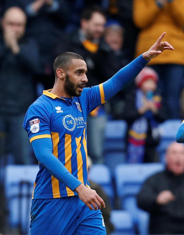 Stefan Payne secured ten-man Shrewsbury victory over Wimbledon and moved them back into top spot