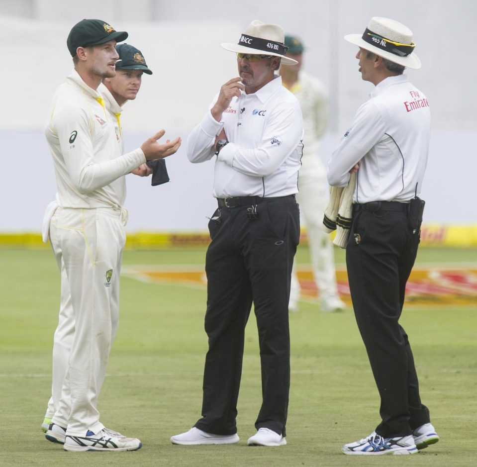  Umpires Nigel Llong and Richard Illingworth confront Australia's Cameron Bancroft during day three of the third Test