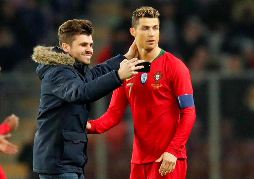  Cristiano Ronaldo fan takes a selfie with his hero after going in for the kiss