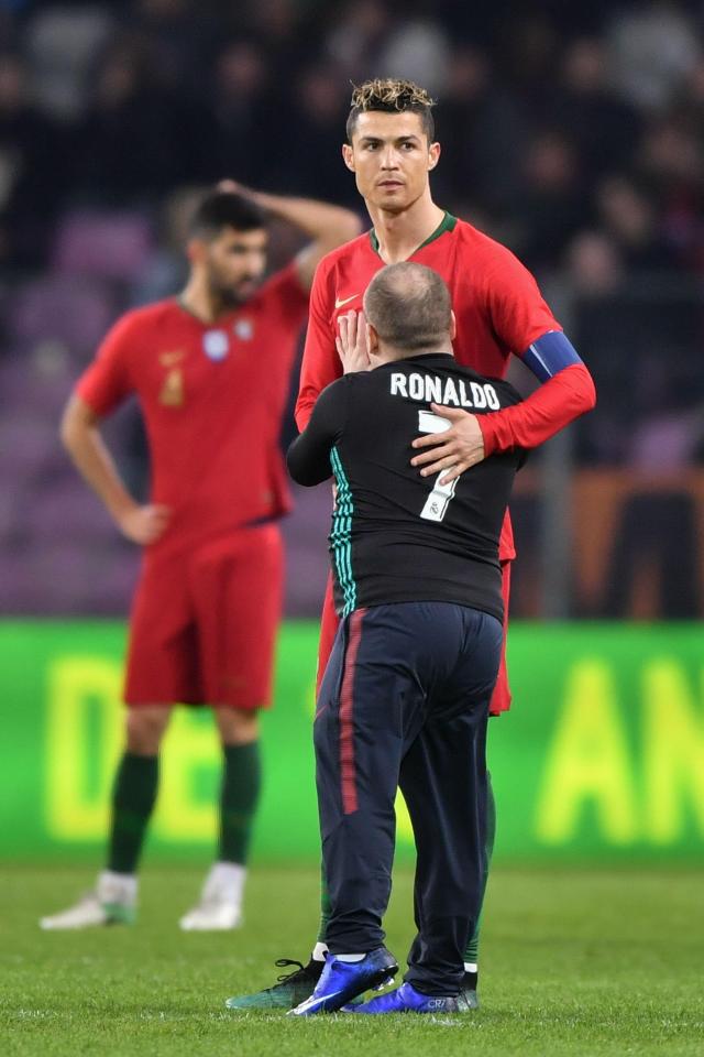  Another fans runs on the pitch to show Cristiano Ronaldo some love