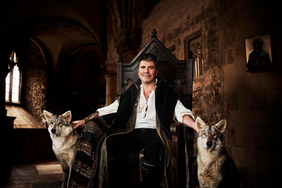  Simon Cowell posed as King Arthur with a pair of wolves at his side