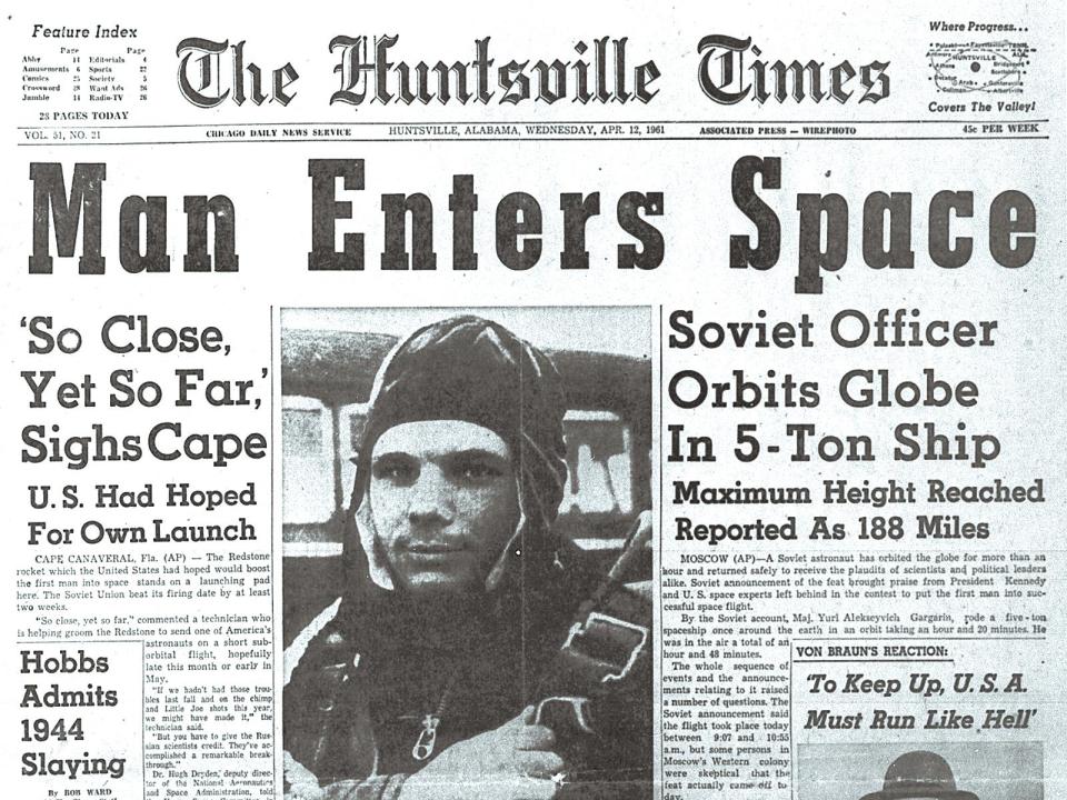  Soviet cosmonaut Yuri Gagarin, the first man to travel into space, hits the headline of the US paper "The Huntsville Times" on April 12, 1961 after oribiting Earth aboard the Vostok I spaceship