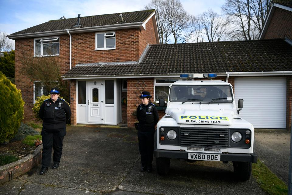  Police stand guard outside the Skripal home in Salisbury