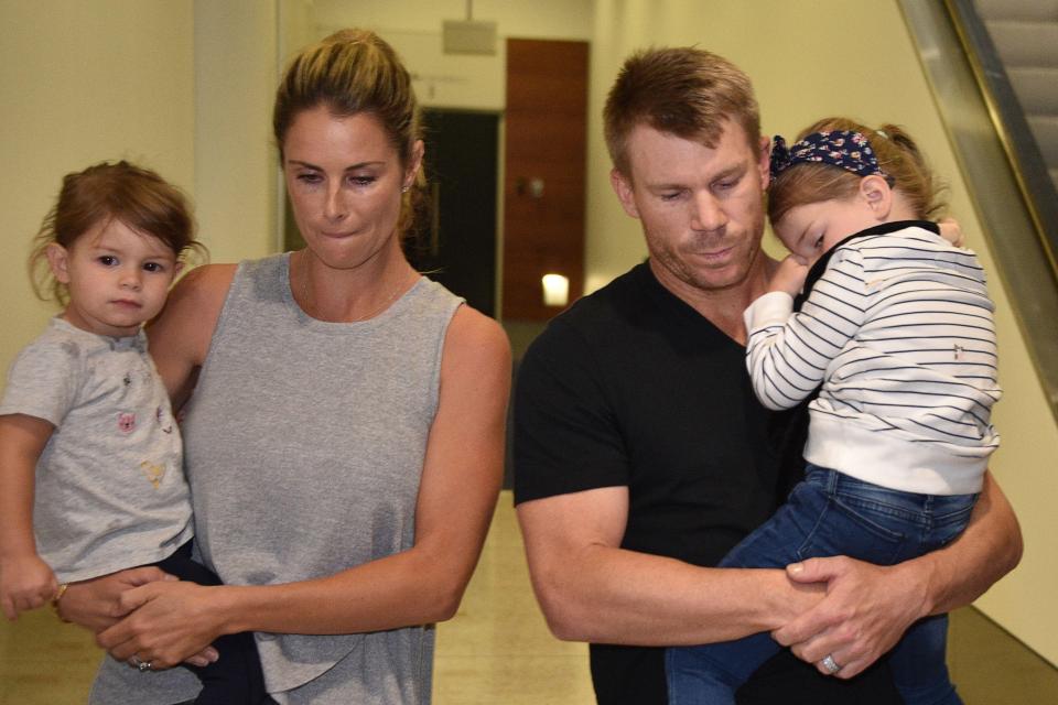  David Warner with wife Candice and their two children after arriving back in Sydney