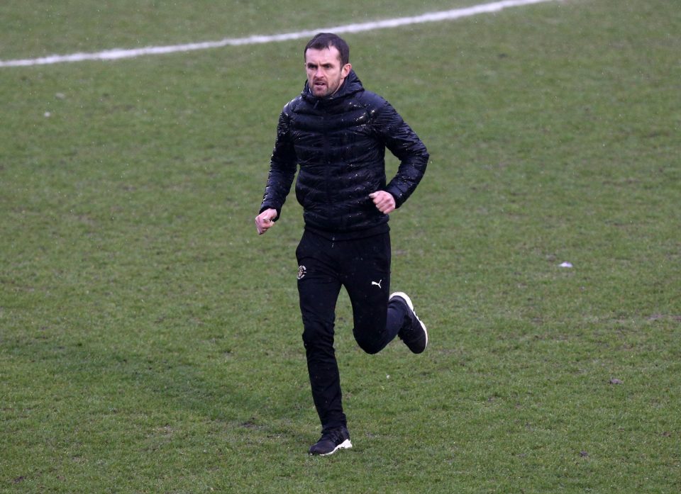  Luton boss Nathan Jones ran on to the pitch to check on his player