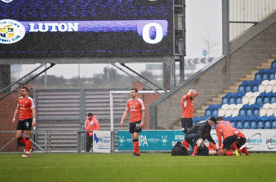  Luton players looked devastated as Luke Berry was treated