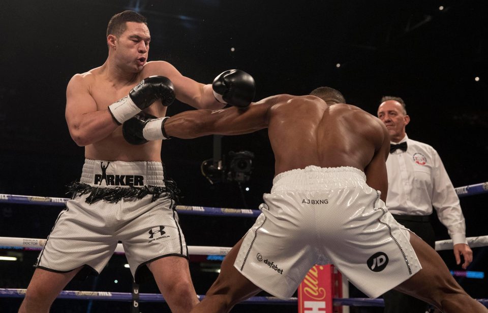  Anthony Joshua does well to dodge Joseph Parker as he catches him in the chest