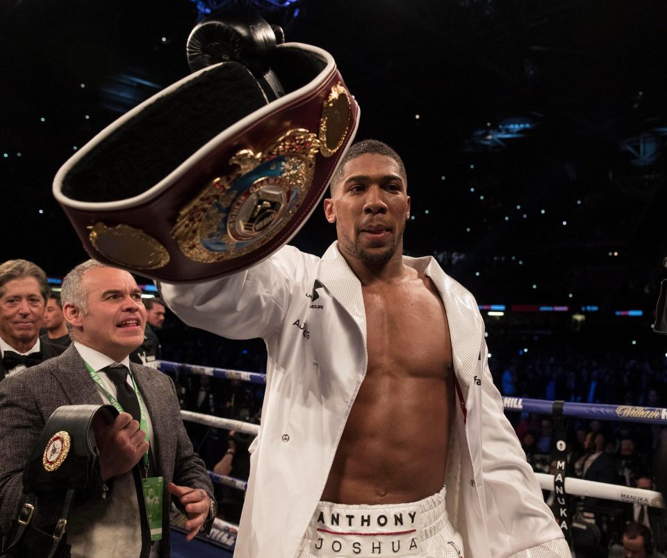  Anthony Joshua celebrates after snatching the WBO heavyweight belt from Joseph Parker