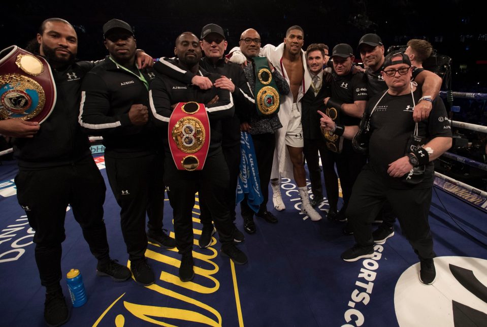  Team Joshua celebrate in the ring after AJ's victory over Joseph Parker