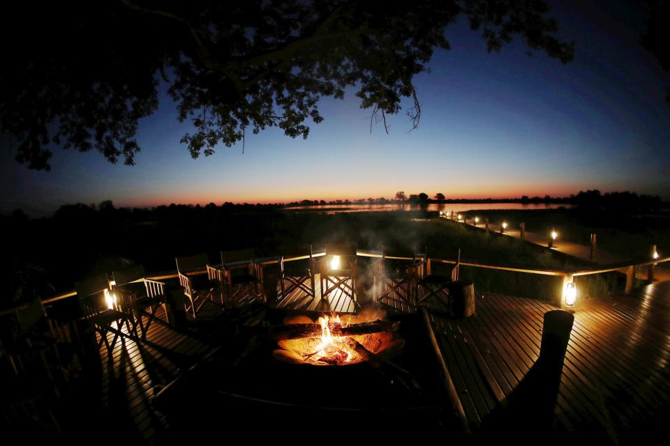  The couple were served a three-course meal beside a glowing fire at the foot of an ancient baobab tree